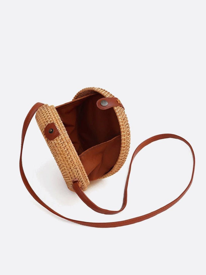 Bolso redondo de ratán con bandolera